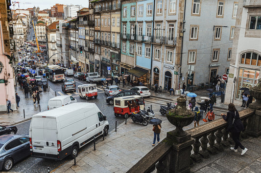 Busy european street with colorful buildings and traffic.